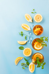 Iced tea with lemon slices, mint and ice