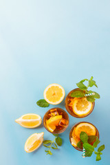 Iced tea with lemon slices, mint and ice