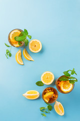 Iced tea with lemon slices, mint and ice