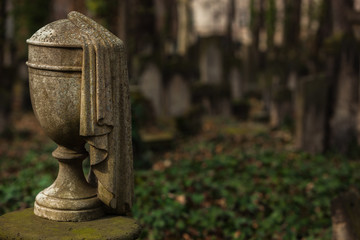 Decorative Stone Urn as a Headstone on a Cemetery - Symbol for Death, Grief, Remembrance