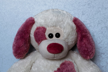Toy plush dog with a red nose and ears