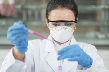 Young female scientist working in the laboratory