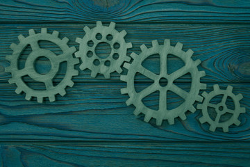 Gears on a wooden background. the mechanism of business interaction.