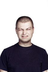 Obraz premium Portrait of young man. Facial expression. ugly face.