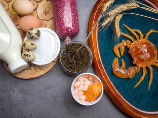 Foods Highest in Zinc as crab, black caviar, scallop, shrimps, wheat, eggs, milk, cheese, meat Top view