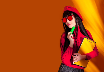 business woman yellow background red shadow beret brunette teacher glasses funny