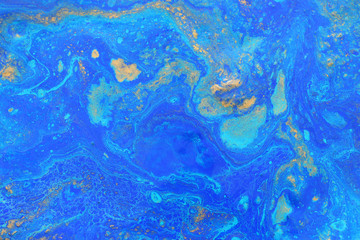 Fototapeta na wymiar Abstract marbleized effect background. Blue creative colors. Beautiful paint with the addition of gold