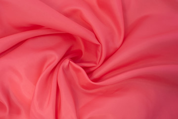 bright scarlet fabric twisted in the center