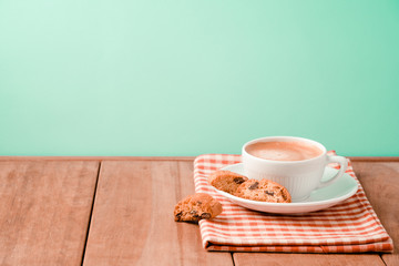 Coffee cup with italian biskotti cookies on wooden table  background