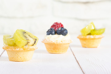 Fruit tartlets on the wite table