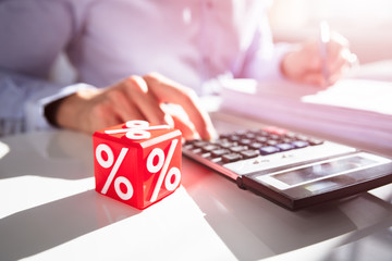 Close-up Of Red Cubic Block With Percentage Symbol