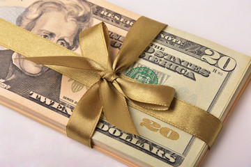 Dollar banknotes and color bow