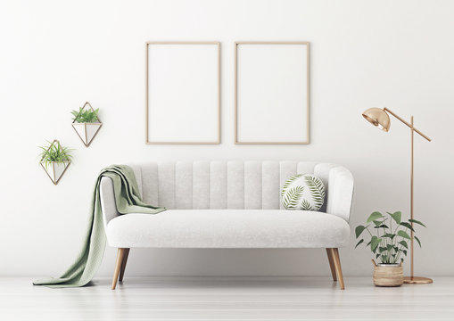 Poster mockup with two vertical frames on empty white wall in living room interior with gray velvet sofa, round pillow with tropical pattern, green plaid, lamp and plant in basket. 3D rendering.