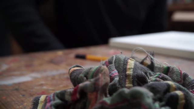 Overview Of An Artist's Tools On A Table, Paint Palette, Rag, Canvas