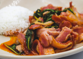 Stir-fried basil is a Thai food with a spicy flavor.