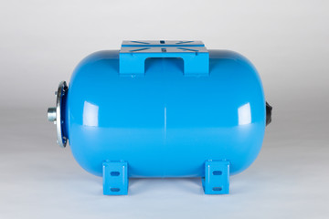 Blue horizontal pressure tank.