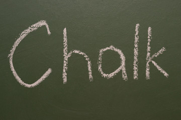 Hand-written chalk inscription "chalk" on a green board