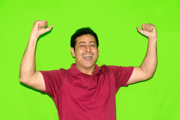 Fototapeta premium Young Indian man cheering