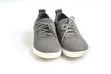 Gray fashion sports shoes on isolated white background.
