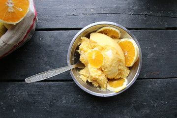 corn porridge with oranges in a plate