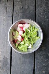 Fresh vegetable salad on plate. Radish and cabbage.