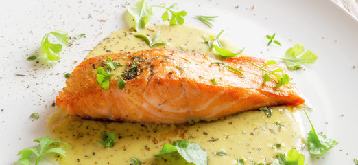 salmon fillet with fresh herbs and spices in lemon-mustard sauce 