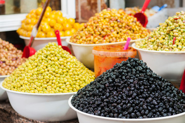 Marinated green and black olives / Market stall with marinated green and black olives.