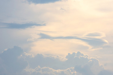 The beauty of the sky with clouds and the sun in summer.