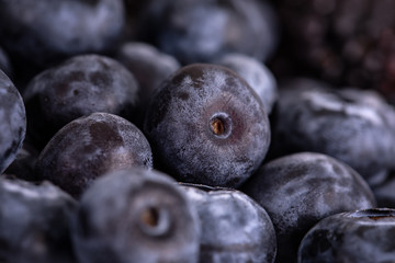 Blueberries and blackberries berries close-up.