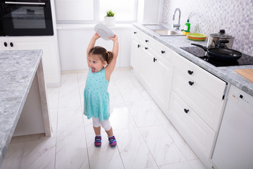 Girl Throwing White Plate