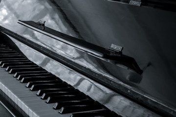 Old black piano. Black piano keys