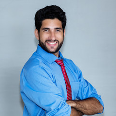 Portrait of laughing latin american hipster businessman