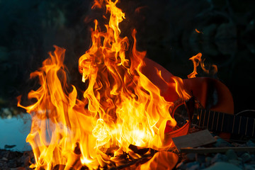 Burning Guitar with Dark Background