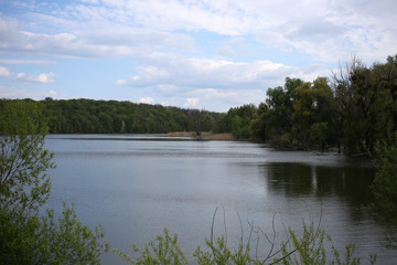 Spring landscape, clear lake where you can swim and fishing.