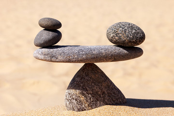 Fototapeta na wymiar Symbolic scale of the stones. Concept of harmony and balance. work-life, emotional balance.
