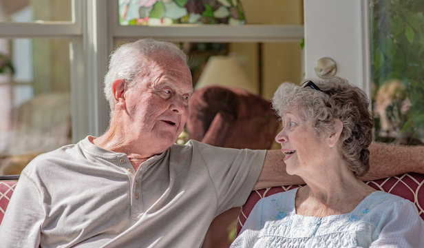 A Senior Woman Talks To Her Husband. A Senior Couple In Their Seventies Has A Serious Conversation Together.