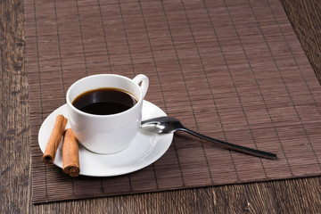 Cup of black coffee on wooden table