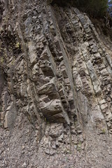 The protruding rock on the mountainside.