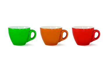 green, orange, red mugs on white isolate background