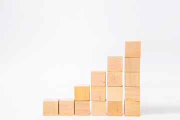isolated wooden cubes increase on white