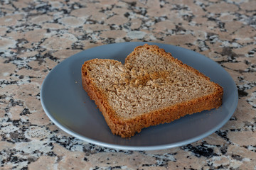 Thick toast with peach jam on blue plate