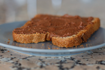 Slice toast with cocoa cream on blue plate
