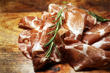 Italian sliced cured coppa with spices. Raw ham. Crudo or jamon cured cold meat