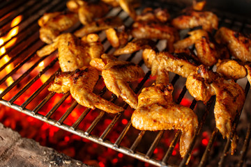 Chilli chicken wings on a grill
