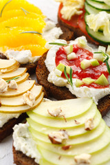 Healthy breakfast. bruschetta with fruit, cheese and nuts. A Banquet snack.