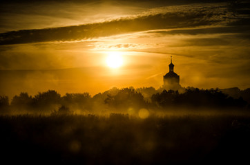 Fototapeta na wymiar silhouette of church at sunset