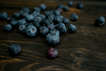 Blueberries on Dark Wood Background