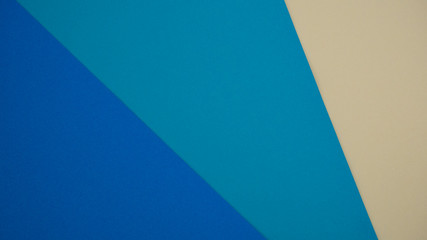 Sheets of paper in different colors. Blue and yellow. Colorful background.