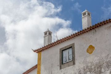 Fototapeta na wymiar View of cornice and upper corner of building facade, traditional chimney