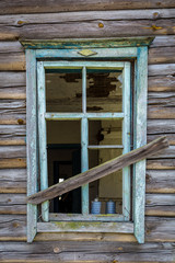 Windows with broken glass of an old abandoned house in Belarus Chernobyl exclusion zone in Belarus